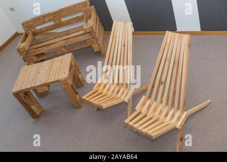 Furniture made of solid wood and wooden pallets - upcycling Stock Photo