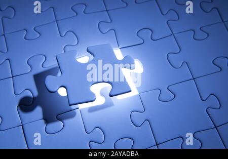 Blue jigsaw puzzle. Business solutions, solving problems,science technology and team building concept. Stock Photo