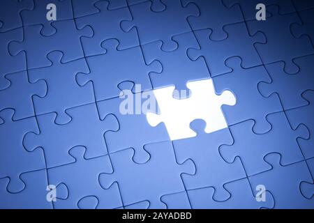 Blue jigsaw puzzle. Business solutions, solving problems,science technology and team building concept. Stock Photo
