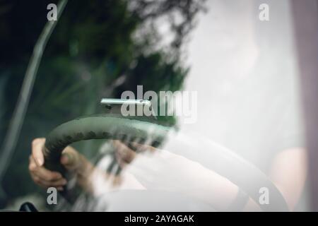 woman using smartphone in a car Stock Photo