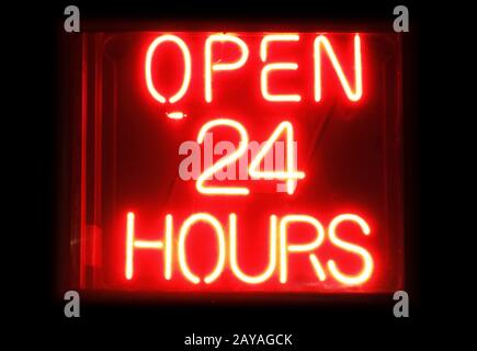 Open 24 Hours neon sign Stock Photo