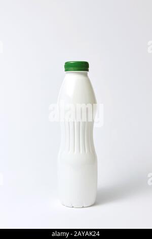White plastic bottle mock up for yogurt on a light background. Stock Photo