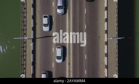 Drone's Eye View - Aerial view of urban traffic jam on bridge Stock Photo