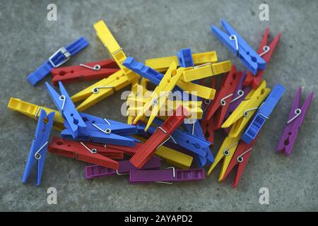 Colorful Plastic Clothespins Scattered Stock Photo