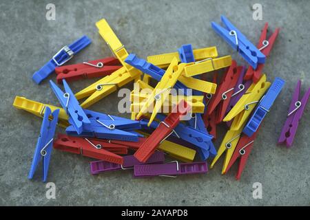 Colorful Plastic Clothespins Scattered Stock Photo