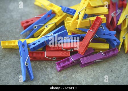 Colorful Plastic Clothespins Scattered Stock Photo