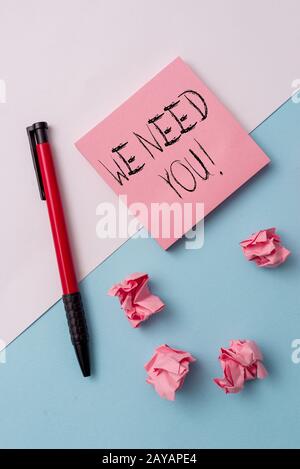 Writing note showing We Need You. Business photo showcasing asking someone to work together for certain job or target Note paper Stock Photo