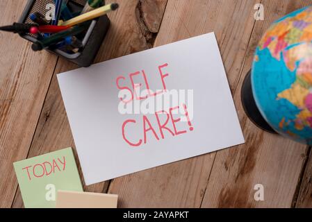 Writing note showing Self Care. Business photo showcasing practice of taking action to preserve or improve ones own health Writi Stock Photo