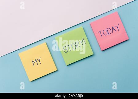 Text sign showing My Story. Conceptual photo your past life events actions or choices you made Pastel colour note papers placed Stock Photo