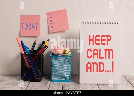 Conceptual hand writing showing Keep Calm And. Business photo showcasing motivational poster produced by British government. Stock Photo