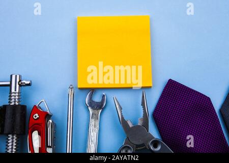 Front view working tools. Wrench clamps screwdriver tie middle note pads. Good advertisement do it by yourself. Man repairing da Stock Photo