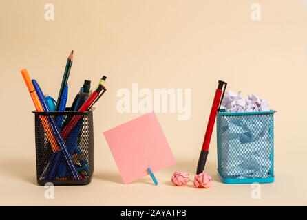Note paper and writing equipment plus scraps placed above pastel backdrop. Empty sheet also stationary stick to soft hued backgr Stock Photo