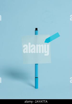 Standing ballpoint blank colored sticky note arrow banner peaceful cool pastel background. Empty text future important events. A Stock Photo