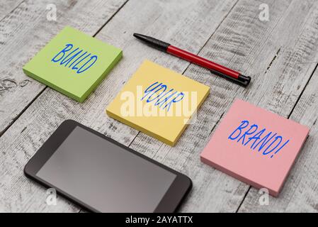 Word writing text Build Your Brand. Business concept for creates or improves customers knowledge and opinions of product Station Stock Photo