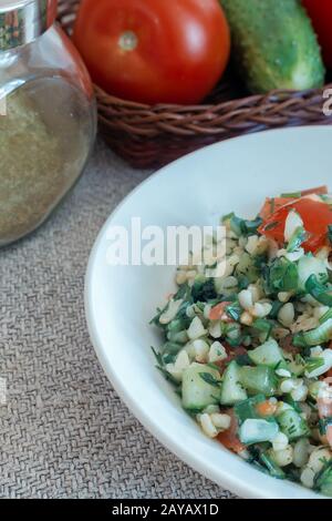 Salad Tabule - a common dish of Arabic cuisine. Stock Photo