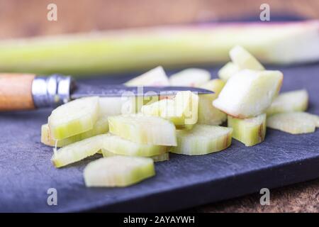 Rhubarb cut on a chopping board Stock Photo