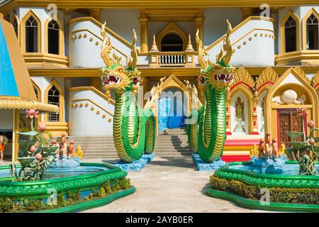 Statues of green dragons at temple in Thailand Stock Photo