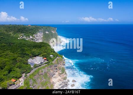 beautiful uluwatu cliff with blue sea in bali island Stock Photo