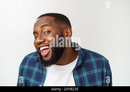 Close up portrait of a handsome young man smiling. Stock Photo