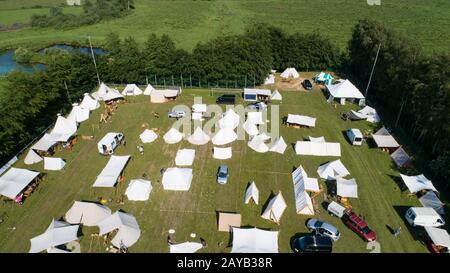 Aerial view of a tent camp and market stalls at a medieval spectacle ...