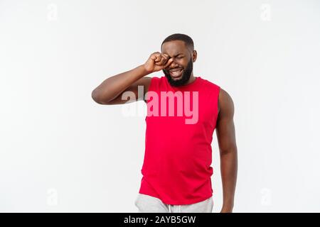 Young african american man over isolated background. Embarrassed and negative concept. Stock Photo