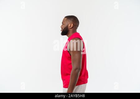 Young african american man over isolated background. Embarrassed and negative concept. Stock Photo