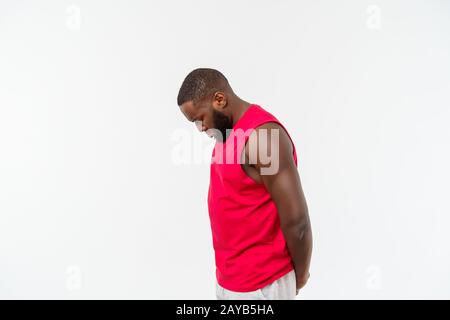 Young african american man over isolated background. Embarrassed and negative concept. Stock Photo