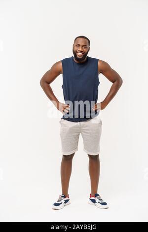 Young fitness african black man in sport wear cheering carefree and excited. Victory concept. Stock Photo