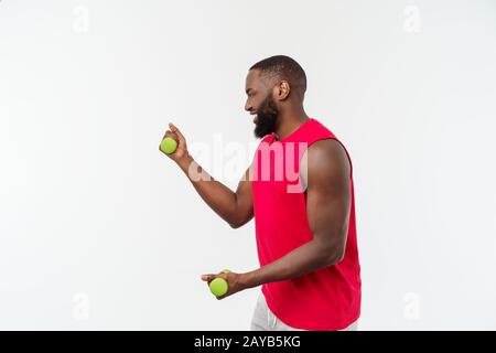 Young African American Athlete Holding Lifting Dumbbells on Isolated White Background. Stock Photo
