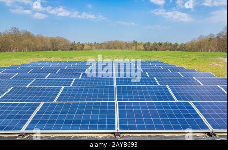 Dutch landscape with blue solar panels field Stock Photo