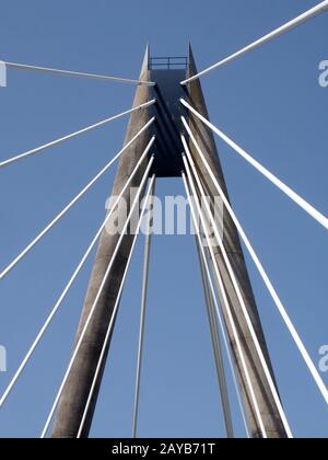 a view of the tower and cables on the marine way suspension bridge in southport merseyside against a blue summer sky Stock Photo