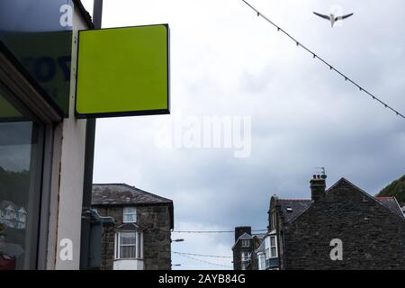 Green ad board on the street with copy space for advertisement. Advertisement concept with blank board on the street. Stock Photo