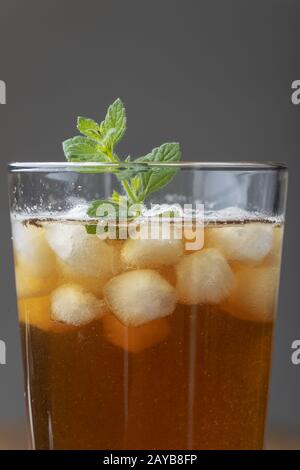 Iced tea on grey background Stock Photo