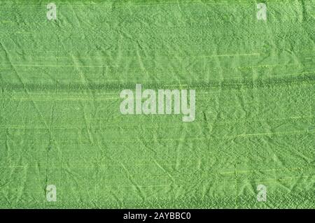 Texture of green shantung silk fabric closeup as textile background Stock Photo