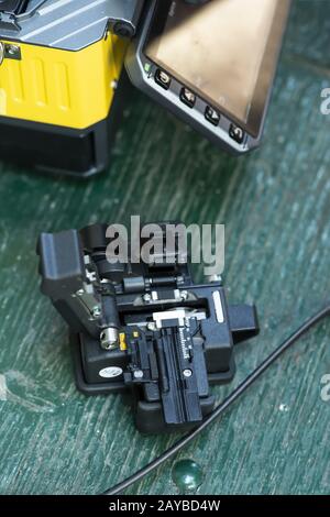 Device for mounting optical cable. Optical internet Technology concept. Stock Photo