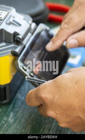 Device for mounting optical cable. Optical internet Technology concept. Stock Photo