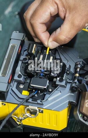 Device for mounting optical cable. Optical internet Technology concept. Stock Photo