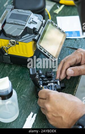 Device for mounting optical cable. Optical internet Technology concept. Stock Photo