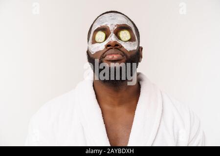 funny laughing man with mask leads healthy lifestyle, rejoicing at morning procedures. positive emotion in the morning. Stock Photo