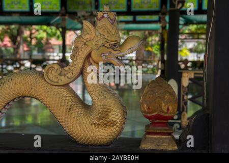 Detail of a naga statue on a fence of one of the pavilions at the Kraton of Yogyakarta (Keraton Ngayogyakarta Hadiningrat), the Sultans palace complex Stock Photo