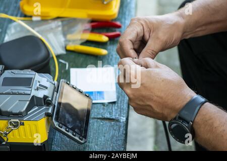 Device for mounting optical cable. Optical internet Technology concept. Stock Photo
