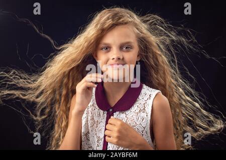 Portrait of a girl with developing hair Stock Photo