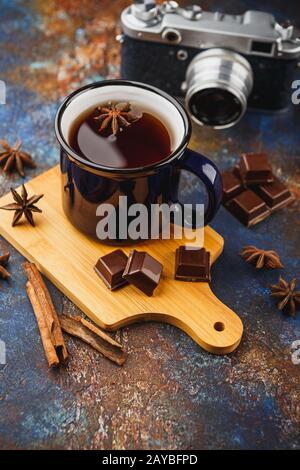 Hot winter tea with cinnamon stick and chocolate Stock Photo