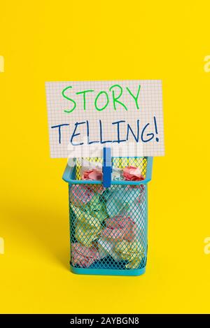 Text sign showing Storytelling. Conceptual photo activity writing stories for publishing them to public Trash bin crumpled paper Stock Photo