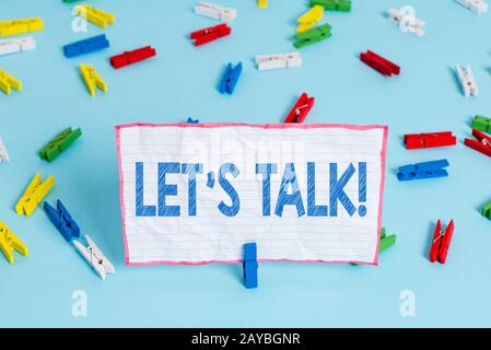 Conceptual hand writing showing Let S Talk. Business photo text they are suggesting beginning conversation on specific topic. Stock Photo
