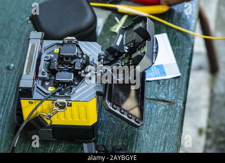 Device for mounting optical cable. Optical internet Technology concept. Stock Photo