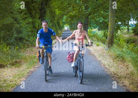 Man, woman, couple, cyclist, head-on Stock Photo