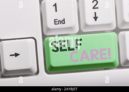 Text sign showing Self Care. Conceptual photo practice of taking action to preserve or improve ones own health White pc keyboard Stock Photo