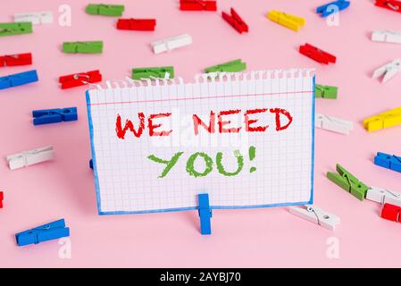 Writing note showing We Need You. Business photo showcasing asking someone to work together for certain job or target. Stock Photo