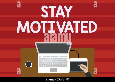 Text sign showing Stay Motivated. Conceptual photo Reward yourself every time you reach a goal with knowledge Upper view laptop Stock Photo